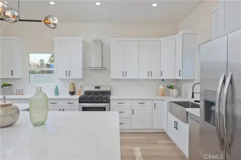 Finished white kitchen with island, Encino remodel