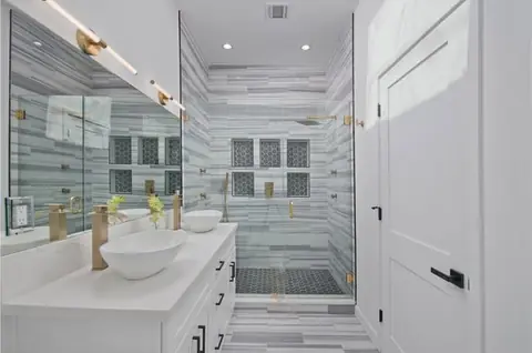 Finished walk-in shower with marble tile, Encino remodel