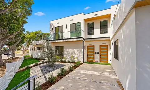New two-story homes with wood-slat entry doors, 10919 Massachusetts Ave, Los Angeles
