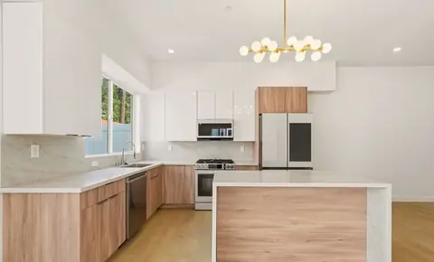 New kitchen with island and pendant lights, 10919 Massachusetts Ave, Los Angeles